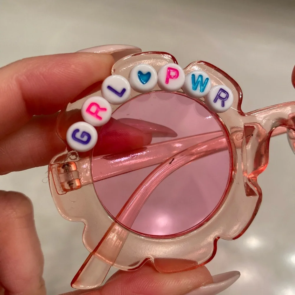 Girls pink see through flower shaped grl pwr sunglasses